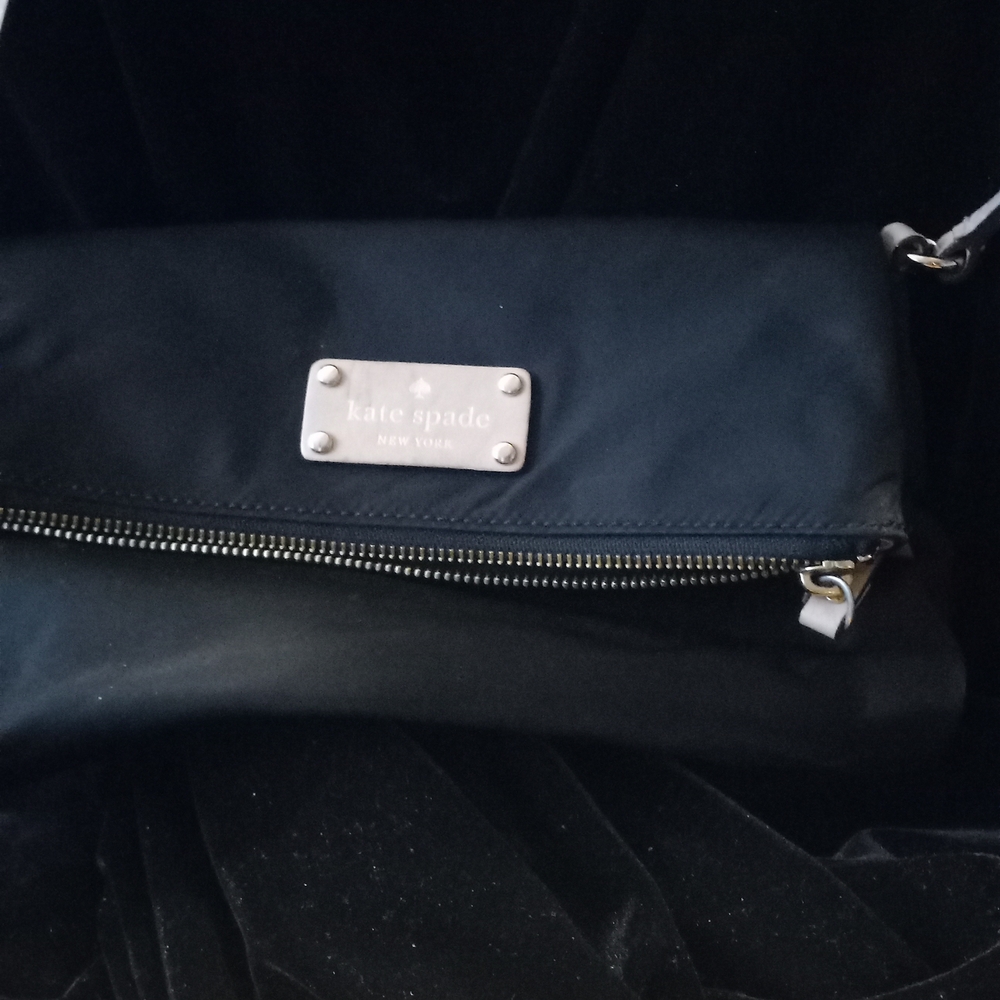 kate Spade black nylon fold-over clutch with silver plaque and zipper 6"x10"